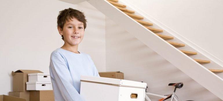 Boy unpacking in new home