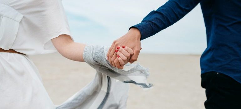 a couple holding hands