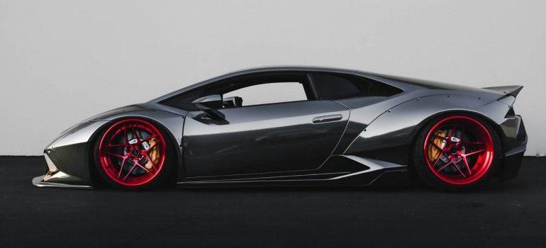 Black Lamborghini with red rims