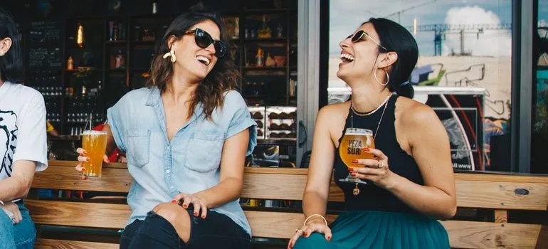 Two women at a bar.