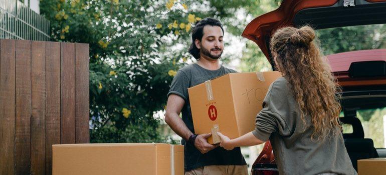 People carrying boxes.