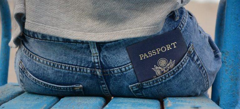 A passport in a man's back pocket