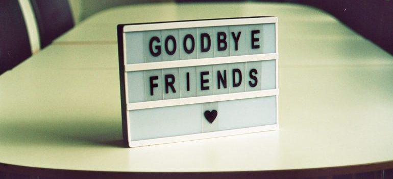 table decoration with letters spelling "goodbye friends"