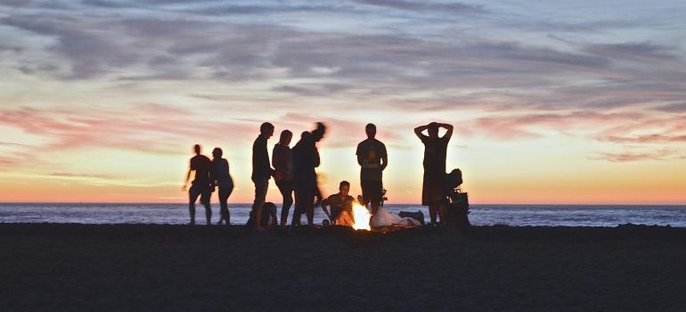 a group of friends camping at the beach