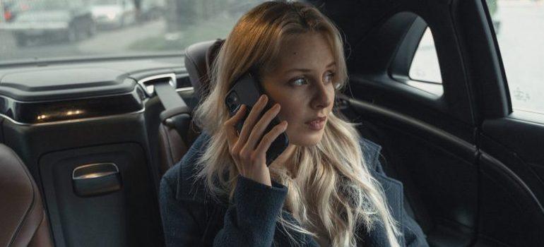 woman in a car talking on the phone