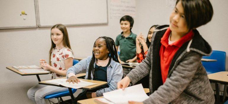 children smiling inside the classroom