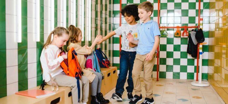 four children at school hanging out