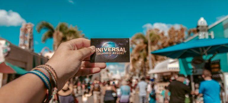 A girl's hand holding a printed out ticked for Universal Studios 