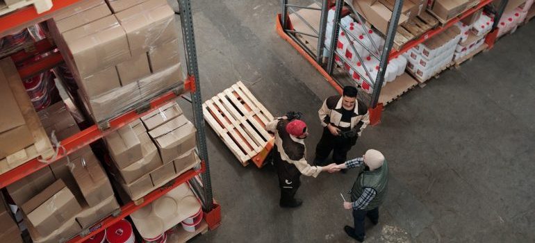 Men working in warehouse