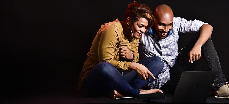 a couple using computer