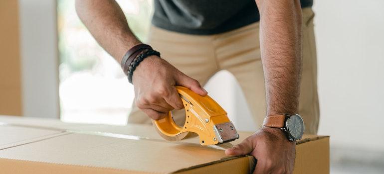 a man packing a box