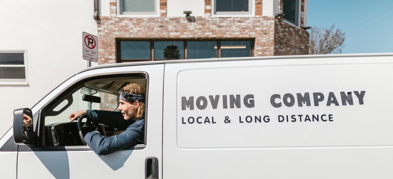 a guy in a moving company van