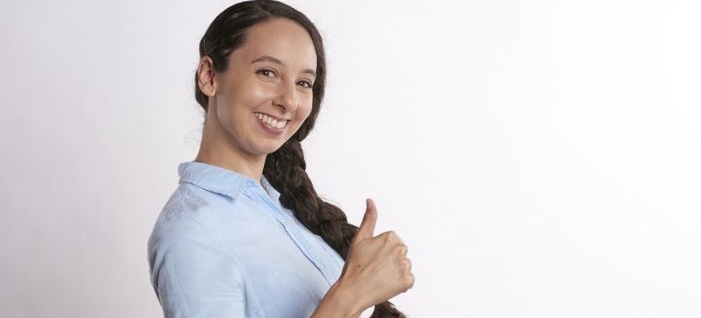 A woman giving a thumbs up 