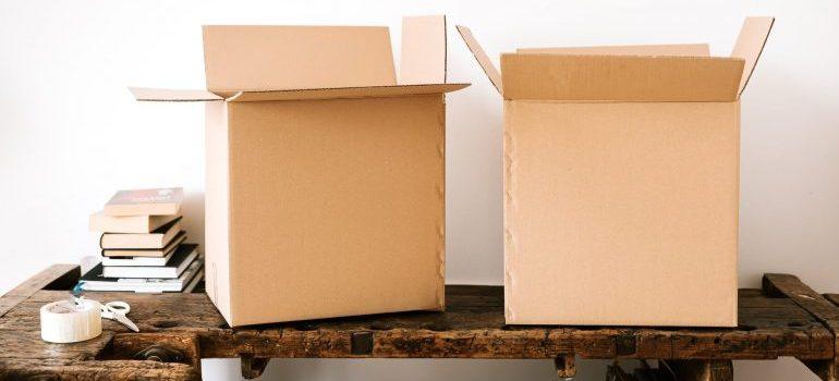 Two boxes on a wooden table
