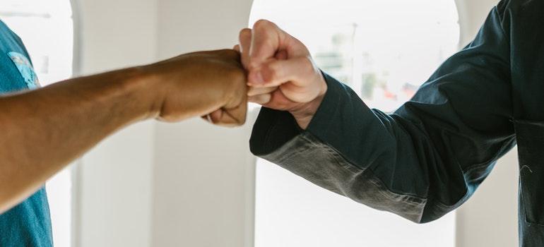 men excited about hiring full-service movers when moving to Chicago