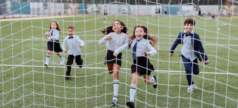 School kids playing in the schoolyard. 