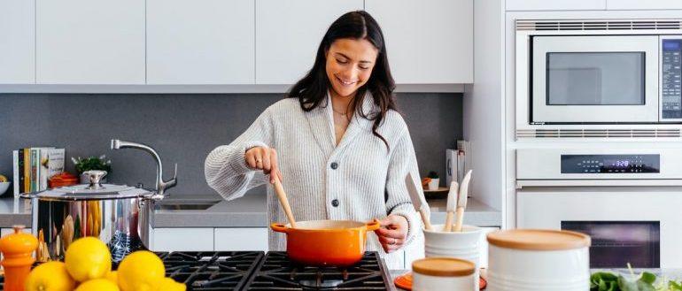 A woman cooking in her kitchen