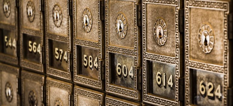 Row of bank safety deposit boxes, that can be used to protect your valuables when you move.