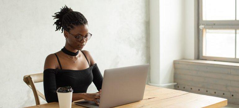 girl sitting in front of a laptop