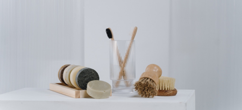 basic toiletries on a shelf to represent things you must pack in your essentials bag