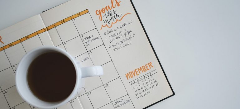 Coffee mug and a planner