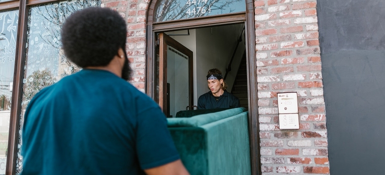 movers carrying a sofa