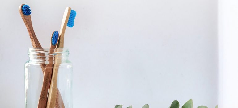 Toothbrushes in a glass.