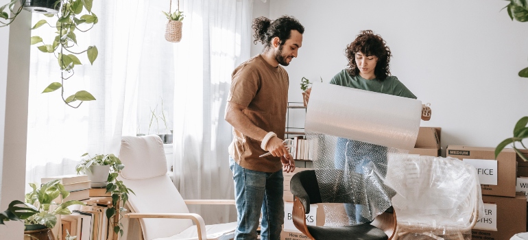 a couple covering furniture