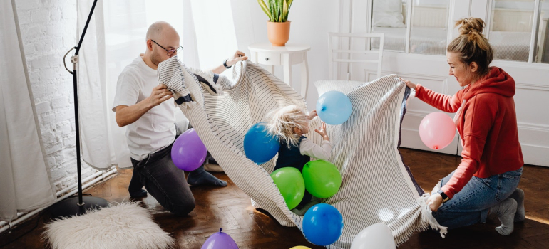 parents playing with toddler