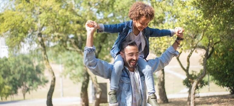 A father with his child playing in the park
