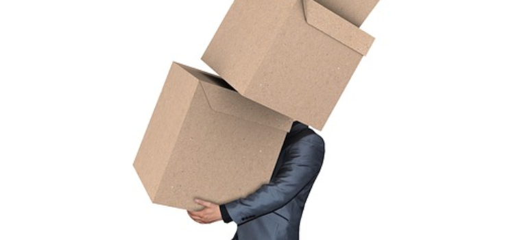 man carrying boxes