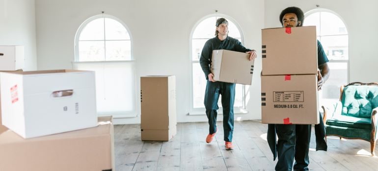 movers preparing boxes for moving to The Woodlands from a big city