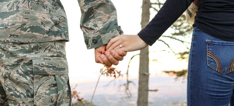 Woman and man holding hands