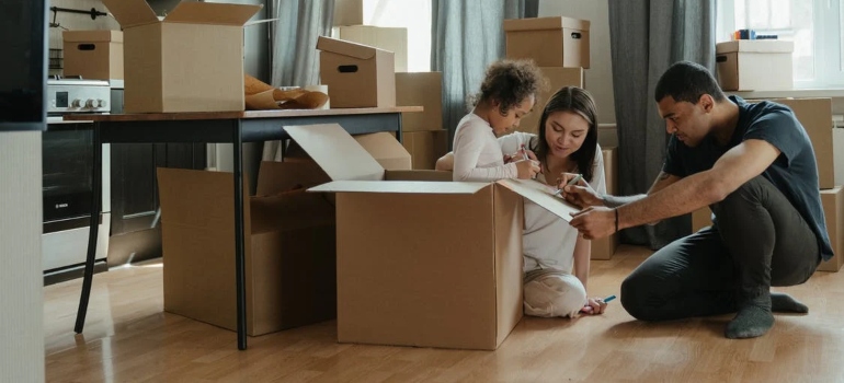 Family unpacking in order to adapt after moving to Dayton