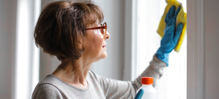 a woman cleaning windows