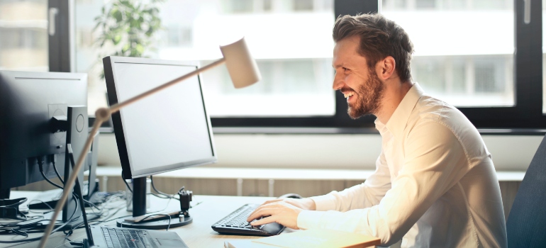 A man looking at his PC