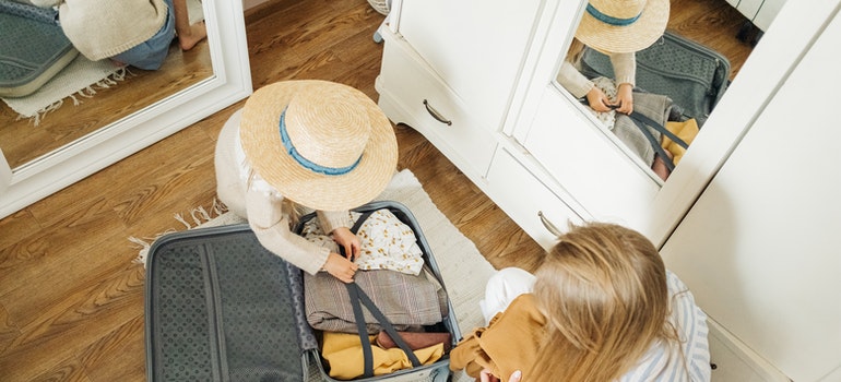 Mother and daughter packing