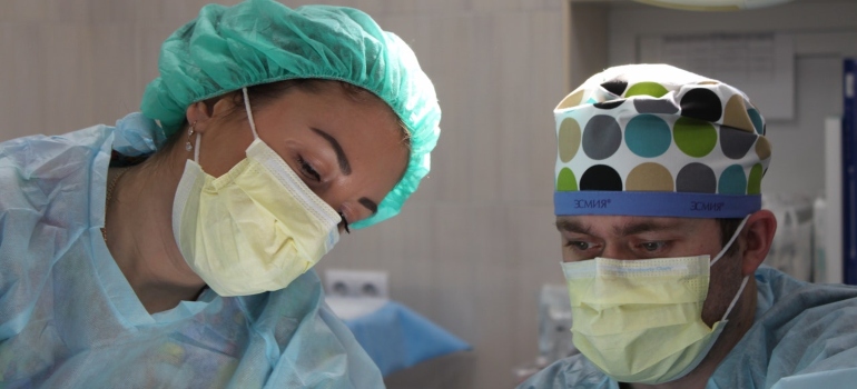 Two doctors performing surgery