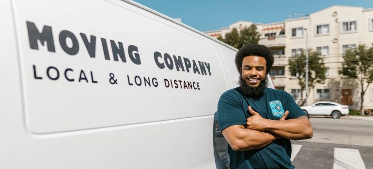 a movers standing in front of a van 