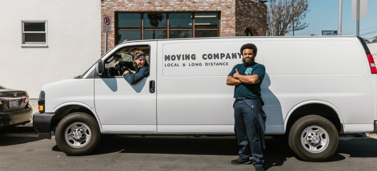 one of the long distance movers Austin has to offer in front of a moving van