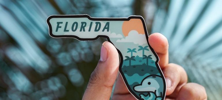 Person holding Florida sign