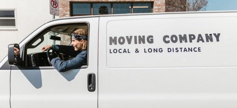 Professional mover in a van has reasons to move from a small town to the big city