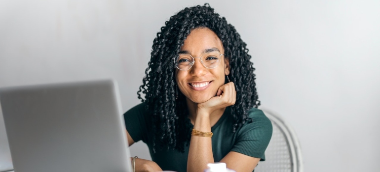 a girl smiling after reading about moving from Dallas to Bethesda