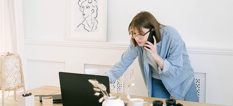 woman calling utility companies before moving to La Grange