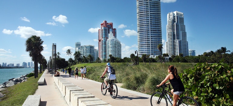People Biking Near Body of Water, after moving from Dallas to Miami.