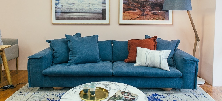 a blue couch in a living room 