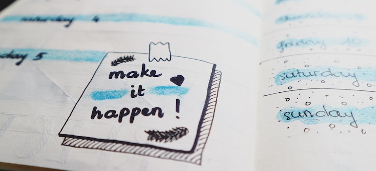 make it happen written in a notebook