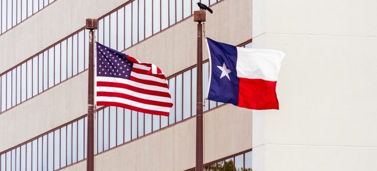 A flag of the USA and Texas