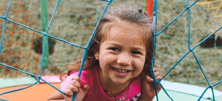 kid smiling on the playground