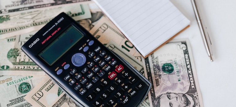 A calculator and money on the table